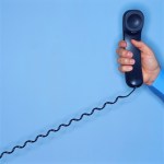 Hand Holding Telephone Receiver